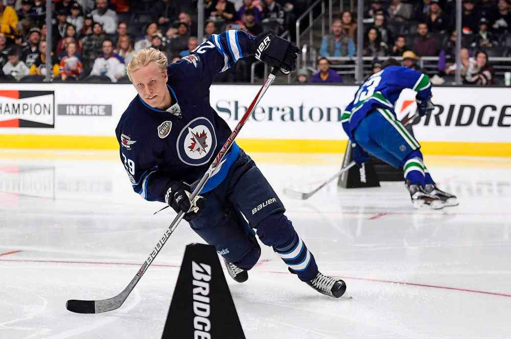 Mark J. Terrill / The Canadian Press files
Winnipeg Jets' Patrik Laine skates against Vancouver Canucks' Bo Horvat during the Fastest Skater portion of the NHL All-Star Skills Competition in 2017 in Los Angeles.