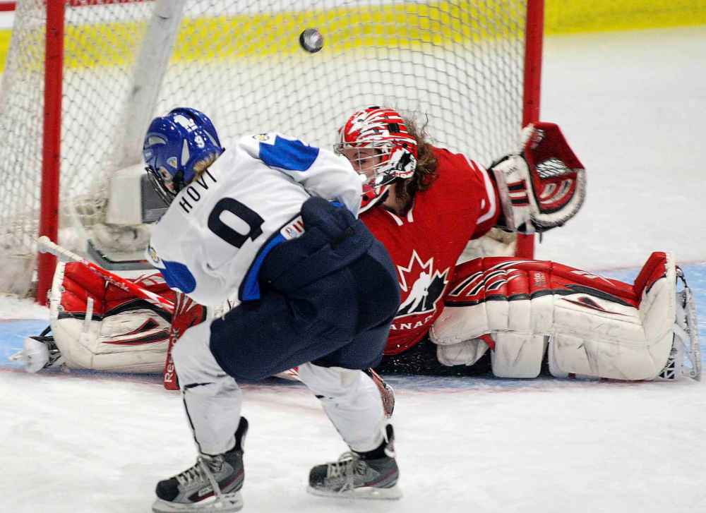 THE CANADIAN PRESS/Ryan Remiorz
Hovi scores against Team Canada's Shannon Szabados during the World Women's Ice Hockey Championships in 2012.