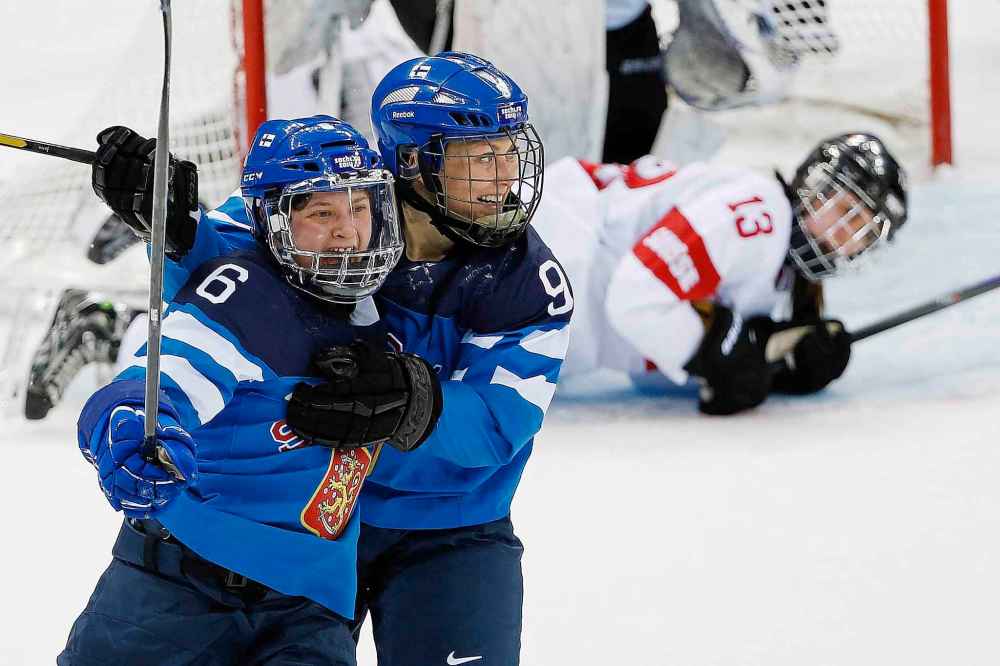 (AP Photo/Petr David Josek)
Hovi, right, celebrates a game-winning goal in overtime with teammate Jenni Hiirikoski of Finland during the 2014 Winter Olympics in Sochi, Russia.
