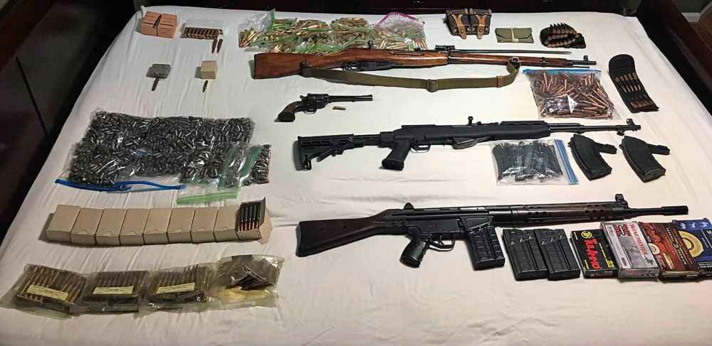 A member of The Base posts photos of weaponry in the group's chatroom.