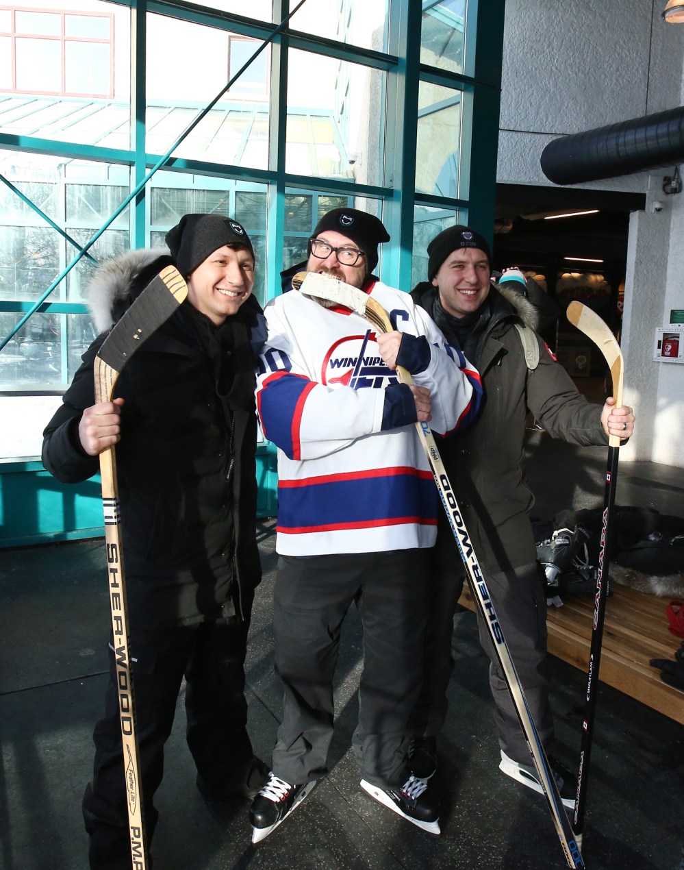Mike Deal / Winnipeg Free Press
Riley (left) and Jeff Slater (right) with James Hatch, a retired U.S. war hero turned PTSD advocate/author, is making good on a bizarre bet with some Winnipeg friends as he laces up the skates and glides down the Red River Wednesday morning.