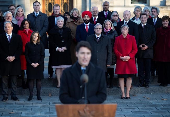 Members of cabinet stand behind Prime Minister Justin Trudeau as he speaks to reporters following a swearing in ceremony at Rideau Hall in Ottawa, on Wednesday, Nov. 20, 2019. THE CANADIAN PRESS/Justin Tang