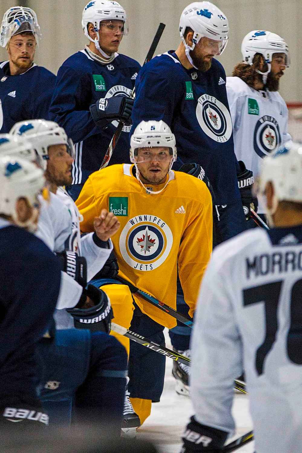 MIKE DEAL / WINNIPEG FREE PRESS
Winnipeg Jets' Dmitry Kulikov (5) wears a yellow jersey while taking part in a pre-season skate at the BellMTS IcePlex Monday morning.
180910 - Monday, September 10, 2018.