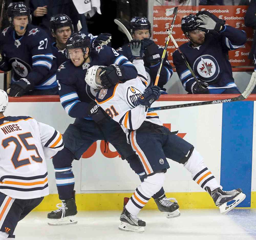 THE CANADIAN PRESS/Trevor Hagan
Winnipeg Jets' Andrew Copp throws Edmonton Oilers' Drake Caggiula to the ice during third period.