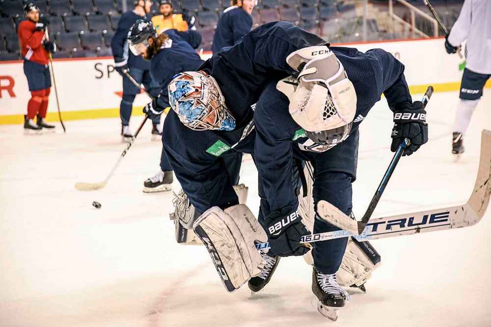 Mike Sudoma / Winnipeg Free Press
Winnipeg Jets goalie Connor Hellebuyck, left and winger Andrew Copp horse around between drills during practice, Wednesday.
- Jason Bell story
October 17, 2018