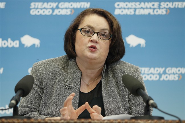 Manitoba Finance Minister Jennifer Howard answers media questions about the Provincial Budget at the Legislature in Winnipeg, Thursday, March 6, 2014. THE CANADIAN PRESS/John Woods