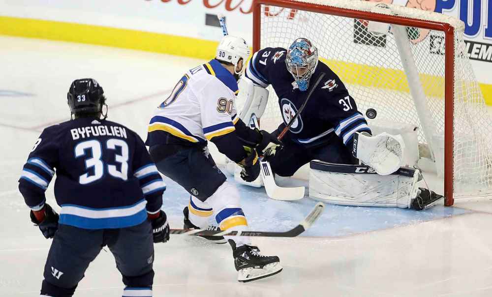 THE CANADIAN PRESS/Trevor Hagan
St. Louis Blues' Ryan O'Reilly  scores on Winnipeg Jets goaltender Connor Hellebuyck during the first period Monday.