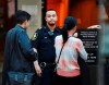 A British Columbia sheriff looks on as people line up at a Vancouver courthouse prior to the bail hearing for Meng Wanzhou, Monday, December 10, 2018. Wanzhou, the chief financial officer of telecommunications giant Huawei and daughter of its founder, was detained at the request of the U.S. during a layover at the Vancouver airport on Dec. 1 (Jonathan Hayward/The Canadian Press via AP)