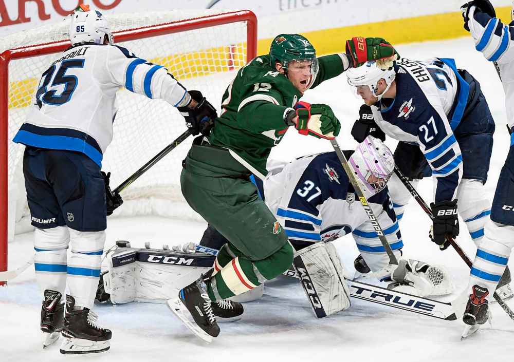 (AP Photo/Hannah Foslien)
Minnesota Wild's Eric Staal celebrates a goal as Winnipeg Jets' Mathieu Perreault, goaltender Connor Hellebuyck and Nik Ehlers watch during the third period Friday in St. Paul, Minn. The Wild won 4-2.