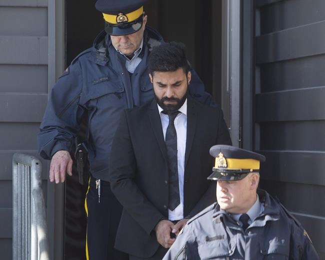 Jaskirat Singh Sidhu is taken out of the Kerry Vickar Centre by the RCMP following his sentencing for the Humboldt Broncos bus crash in Melfort, Sask., on Friday, March, 22, 2019. THE CANADIAN PRESS/Kayle Neis