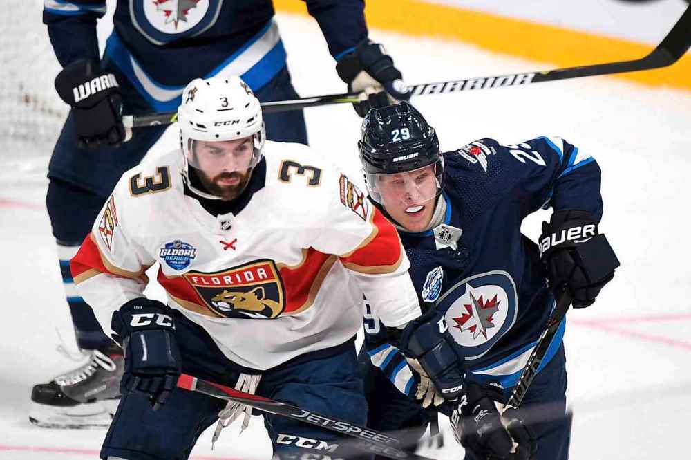 (Martti Kainulainen via Lehtikuva)
Keith Yandie, left, of the Florida Panthers and Patrik Laine of Winnipeg Jets during the NHL Global Series Challenge hockey game Friday in Helsinki, Finland. Laine's four-goal outburst over the two-game series might be just what the doctor ordered for the struggling Jet.