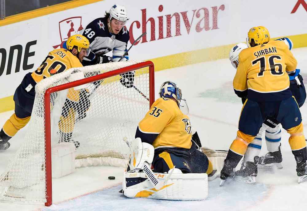 (AP Photo/Mark Zaleski)
Lemieux scores a goal against Nashville Predators goaltender Pekka Rinne in January.