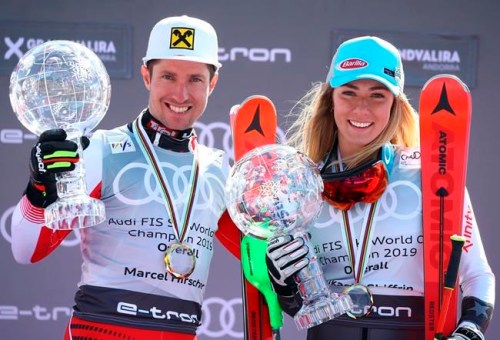 FILE - In this Sunday, March 17, 2019 file photo, Austria's Marcel Hirscher, left, and United States' Mikaela Shiffrin hold the World Cup overall trophies, at the alpine ski finals in Soldeu, Andorra. A new Alpine ski season starts this month, Oct. 2019, with Mikaela Shiffrin the expected superstar and China poised to be a surprise success. Shiffrin is the sport’s most bankable star after Lindsey Vonn, Marcel Hirscher, and Aksel Lund Svindal all retired. (AP Photo/Alessandro Trovati, File)