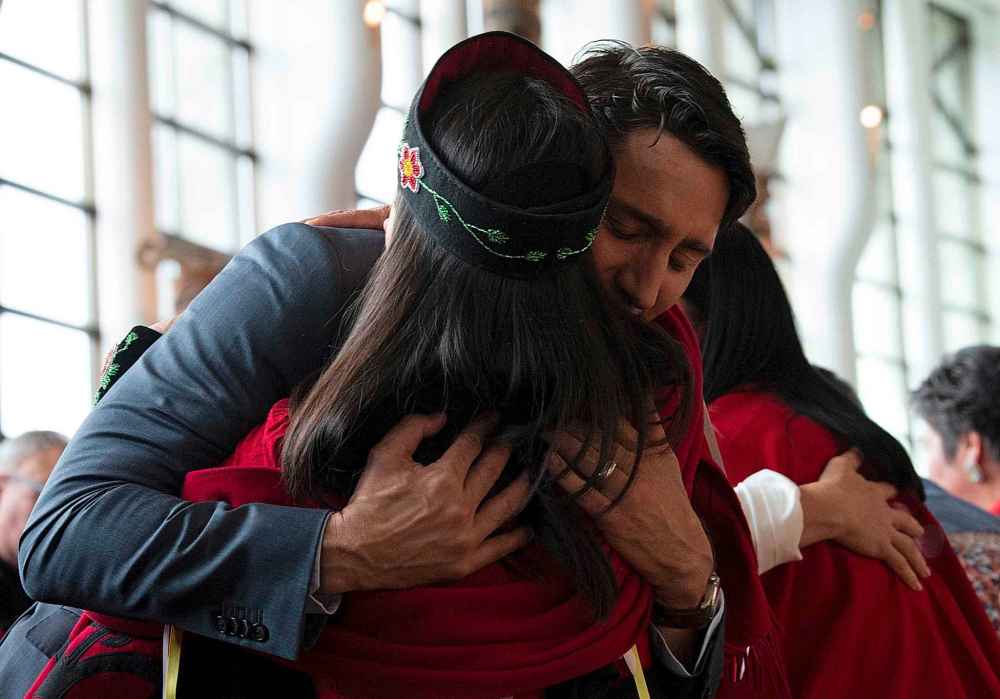 THE CANADIAN PRESS/Adrian Wyld
A woman is embraced by Canadian Prime Minister Justin Trudeau during ceremonies marking the release of the Missing and Murdered Indigenous Women report in Gatineau, Monday.