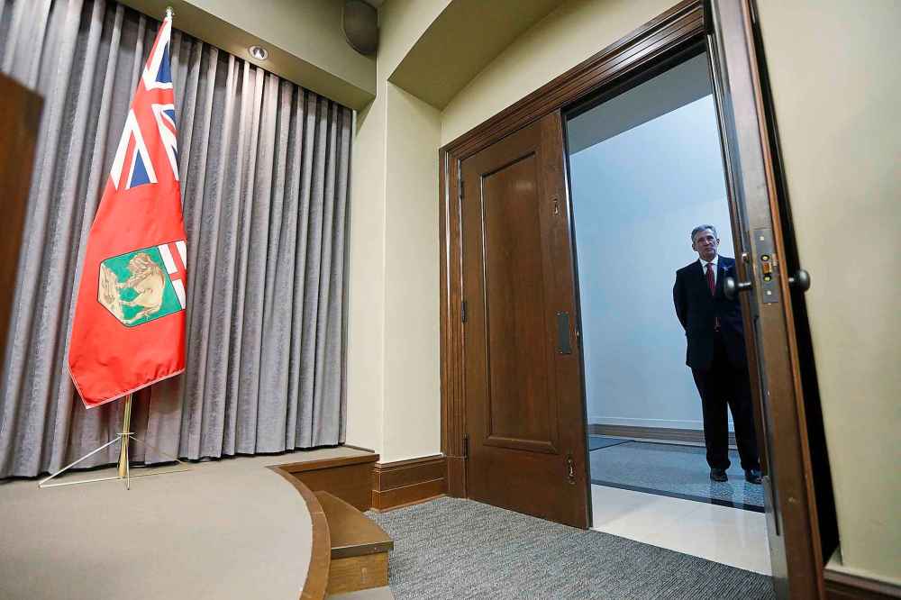 THE CANADIAN PRESS
Manitoba premier Brian Pallister waits in a hallway before speaking to media after the reading of the throne speech at the Manitoba Legislature in Winnipeg, Tuesday, November 20, 2018. THE CANADIAN PRESS/John Woods