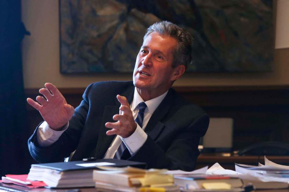 WAYNE GLOWACKI / WINNIPEG FREE PRESS
Premier Brian Pallister in his office Friday with a sample of the reading material he took to Costa Rica.