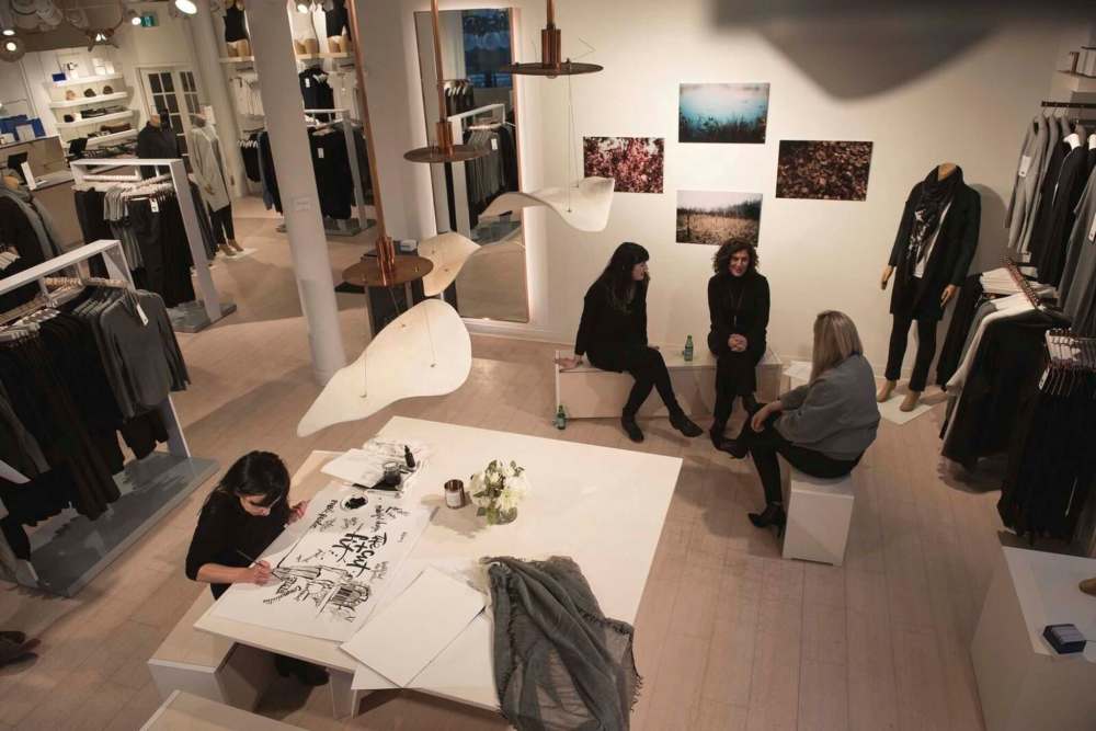 David Moder Photography
Landscape architects Kaili Brown, left, and Constantine Douvris discuss design ideas with Kit and Ace manager Jane Puchniak while artist Kal Barteski takes notes.