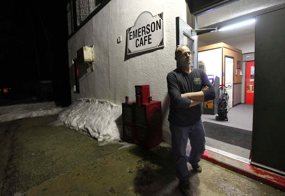 PHIL HOSSACK / WINNIPEG FREE PRESS
Wayne Pfiel stands in the doorway of the Emerson Inn where he manages the bar and keeps a watch for refugees making the trek across snow-covered fields.