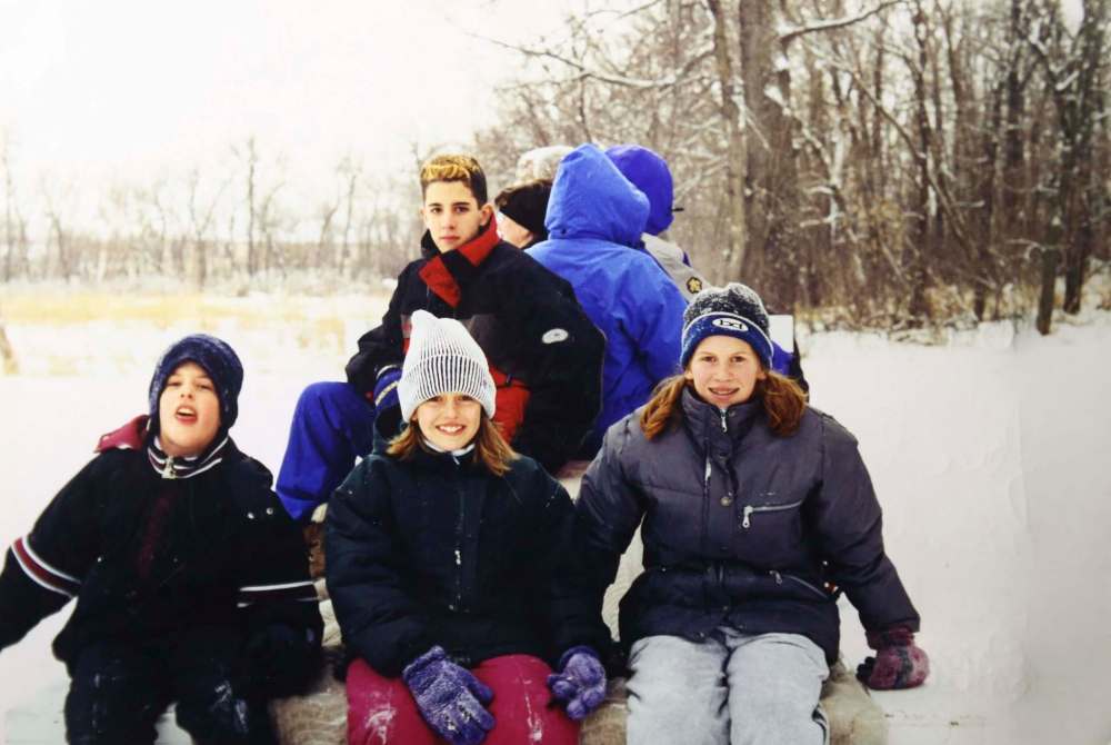 One of many Christmas sleigh rides the families too together.
Back row: Bruce Oake; Front row from left: Darcey Oake, Stephanie Rutherford and Courtney Rutherford. (Submitted)