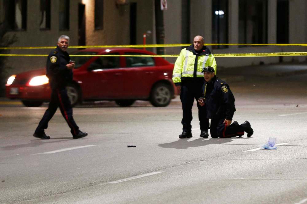 JOHN WOODS / WINNIPEG FREE PRESS
Police investigate a fatal crash that killed a pedestrian on Main Street Tuesday.