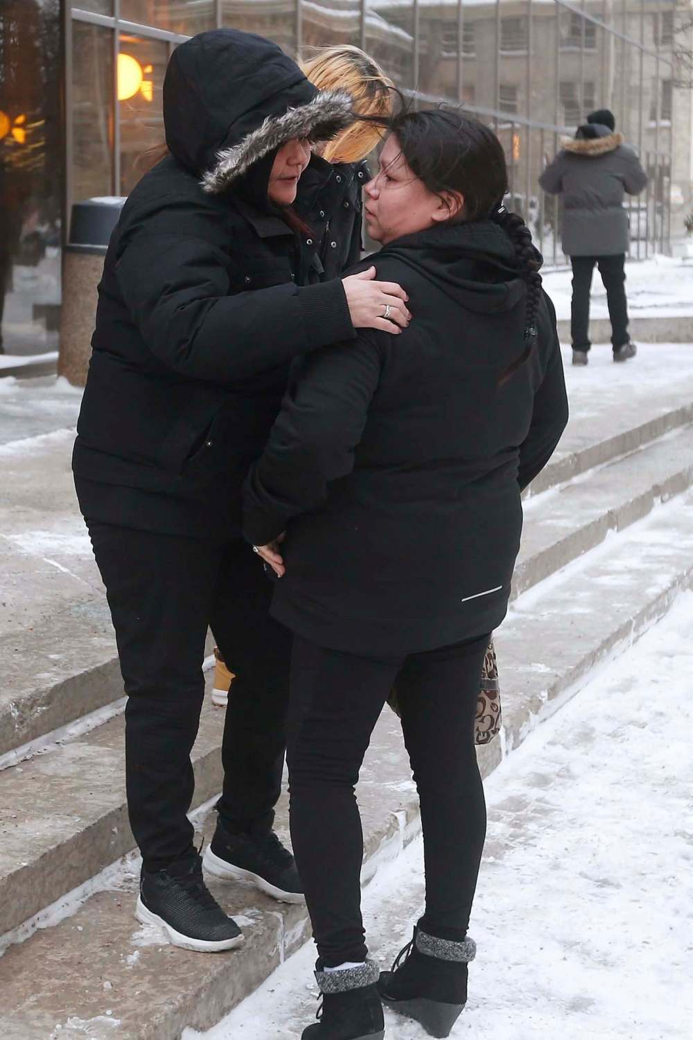 JOHN WOODS / WINNIPEG FREE PRESS
Tina Fontaine's mother, Tina Duck, right, is comforted by friends as she leaves the law courts in Winnipeg, Tuesday.