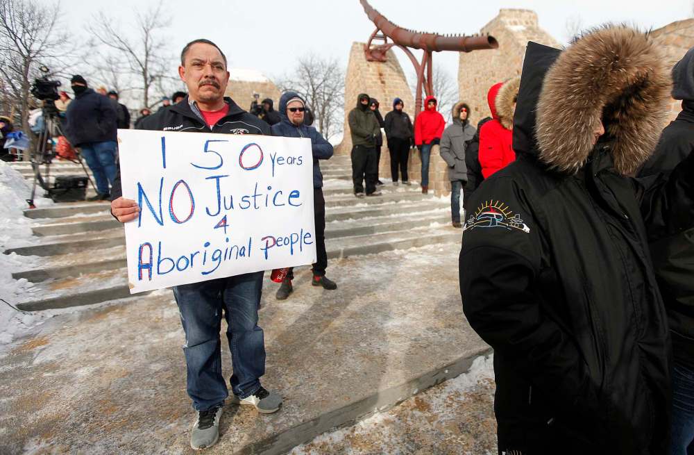 PHIL HOSSACK / WINNIPEG FREE PRESS
A man bears silent witness with his banner at The Forks.
