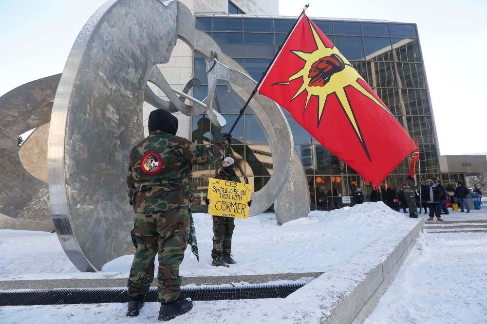 JOHN WOODS / WINNIPEG FREE PRESS
Supporters of Tina Fontaine’s family gather outside the court as lawyers give their closing arguments in the second-degree murder trial of Raymond Cormier on Tuesday.