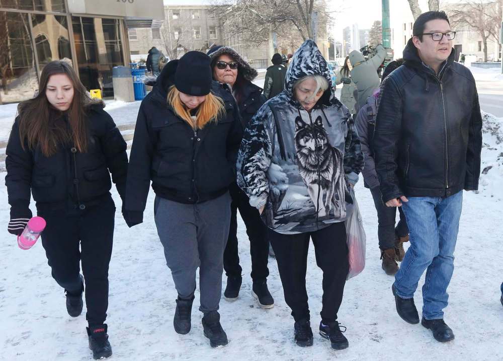 JOHN WOODS / WINNIPEG FREE PRESS
Thelma Favel (centre), Tina Fontaine’s great-aunt, leaves court with family members after listening to closing arguments Tuesday.