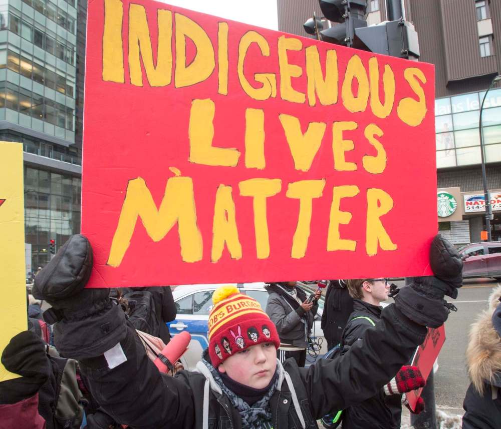 People take part in a vigil in support of Colten Boushie's family, following the acquittal of Saskatchewan farmer Gerald Stanley on charges in connection with Boushie's death, Tuesday, February 13, 2018 in Montreal. THE CANADIAN PRESS/Ryan Remiorz