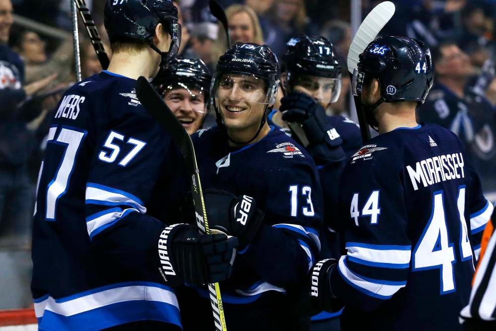 John Woods / The Canadian Press
Brandon Tanev scored a hat trick against Boston Tuesday as the Jets beat the Bruins 5-4 in a shootout.
