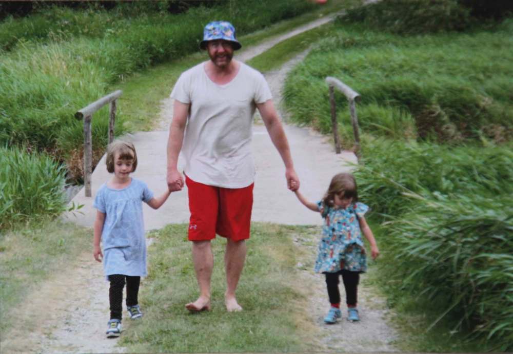 Ace strolls barefoot with his two nieces Alice, 5 (left), and Annie, 3. Growing up, Burpee spent the bulk of his time outdoors. (Supplied photo)
