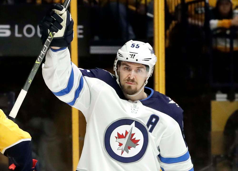 Mark Humphrey / The Associated Press
Jets centre Mark Scheifele celebrates after scoring his first goal Sunday.