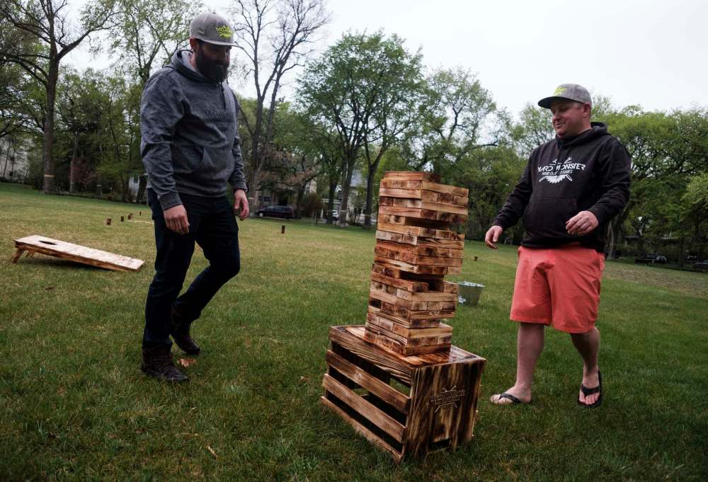 Daniel Crump / Winnipeg Free press
Ashley Nichol (left) and Steve Wesselingplay a game of wobbly wenga.
