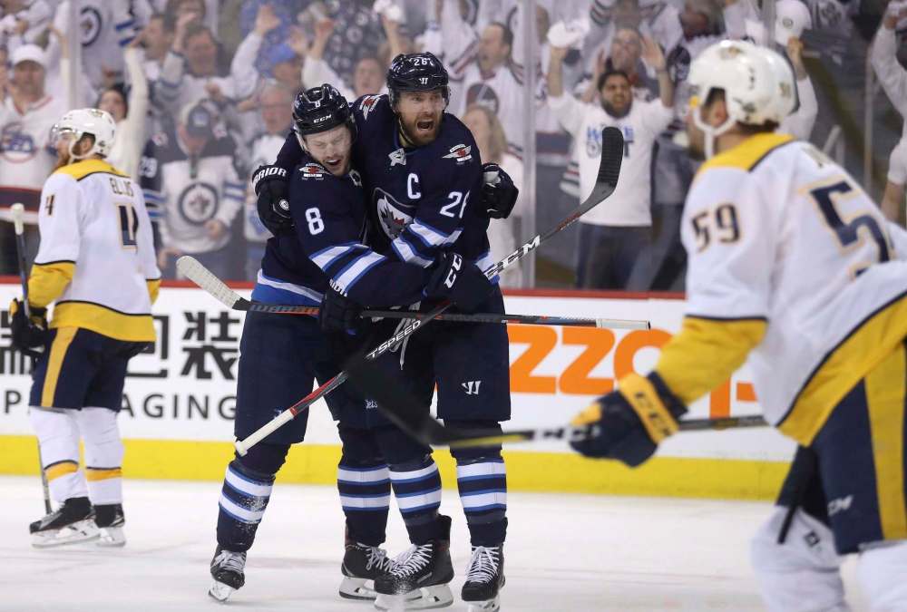 THE CANADIAN PRESS/Trevor Hagan
Winnipeg Jets' Jacob Trouba, left, and Blake Wheeler celebrate after Trouba scored against the Nashville Predators during the playoffs. The 24-year-old defenceman had three goals and 21 assists in 55 games this season.