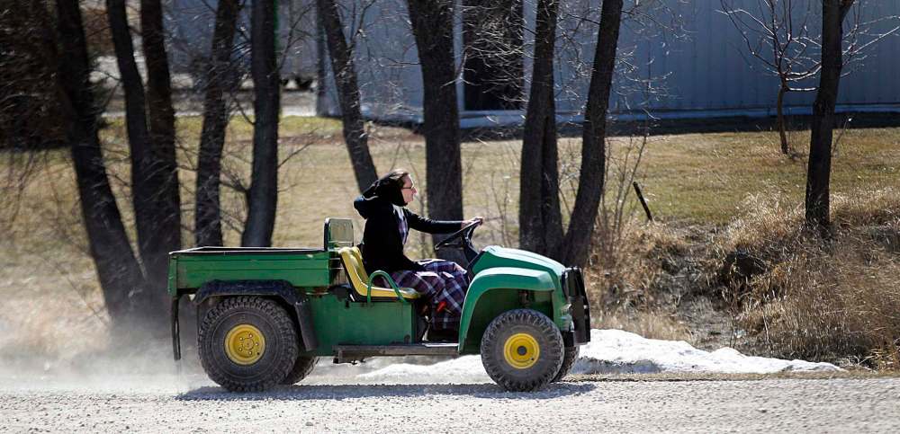 PHIL HOSSACK / Winnipeg Free Press
A community member moves around the colony on a “quad” at James Valley Hutterite Colony.