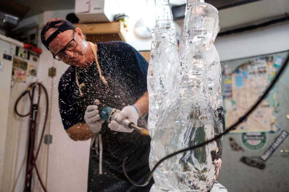 Wade hard at work carving a swan in his Winnipeg studio.