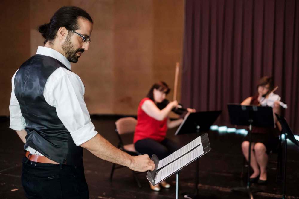 Daniel Crump
WSO composer-in-residence Harry Stafylakis follows the score while musicians try out the 3D-printed violins and violas.