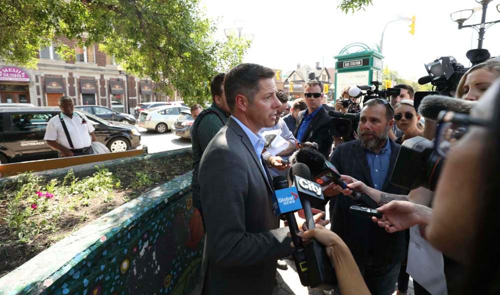 RUTH BONNEVILLE / WINNIPEG FREE PRESS
Mayor Brian Bowman talks to the media in a scrum after presser was held at northeast corner of Osborne St and River about plans by the mayor along with representatives of key community organizations, to address and reduce the occurrence of unsafe panhandling Friday afternoon.