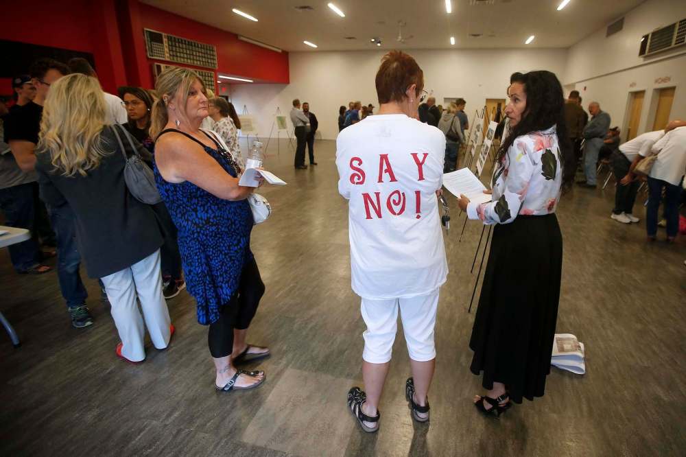 JOHN WOODS / WINNIPEG FREE PRESSPeople for and against a new addictions centre in St James gather and discuss viewpoints at Sturgeon Creek Community Centre for an information night about the proposed centre Tuesday, August 14, 2018.