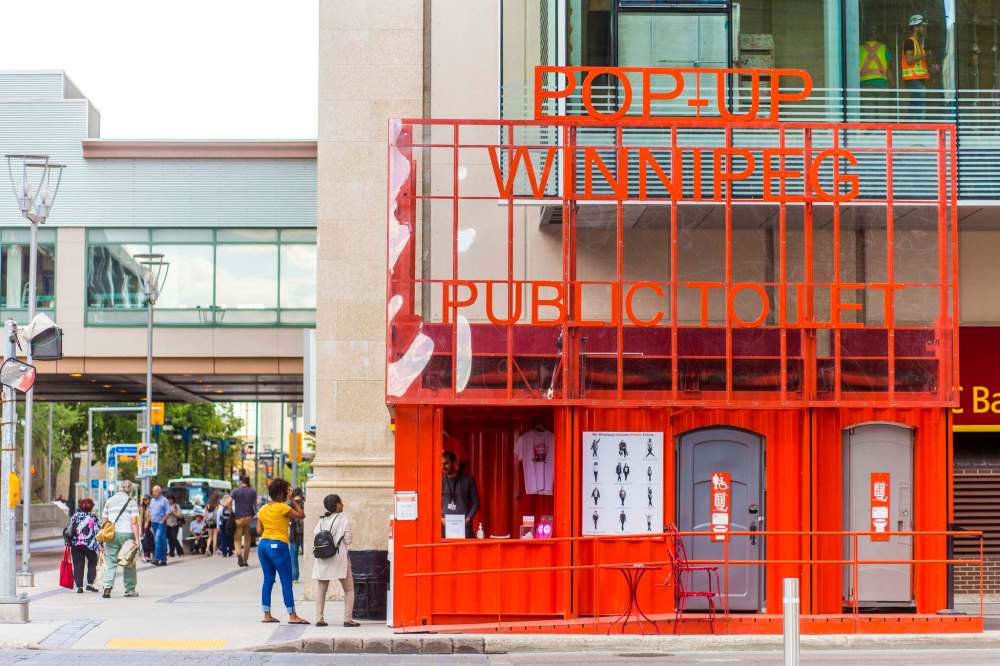 The bright-orange washroom facility has been moved around downtown Winnipeg for the past two months. The toilet is currently at the corner of Hargrave Street and Graham Avenue. (Mikaela MacKenzie / Winnipeg Free Press)