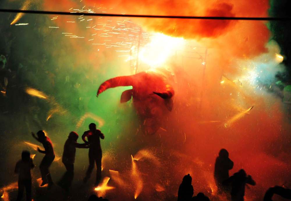 Burning projectiles fly during Tultepec's burning of the bulls in Brimstone & Glory. (Oscilloscope)