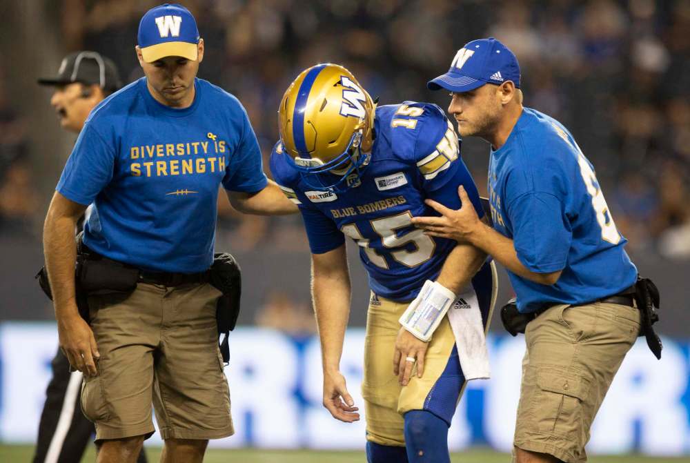 Quarterback Matt Nichols walks off the field after being injured against the Ottawa Redblacks Friday, but came back to finish the game, prompting fans in the stadium to boo the decision. (Andrew Ryan / Winnipeg Free Press Files)
