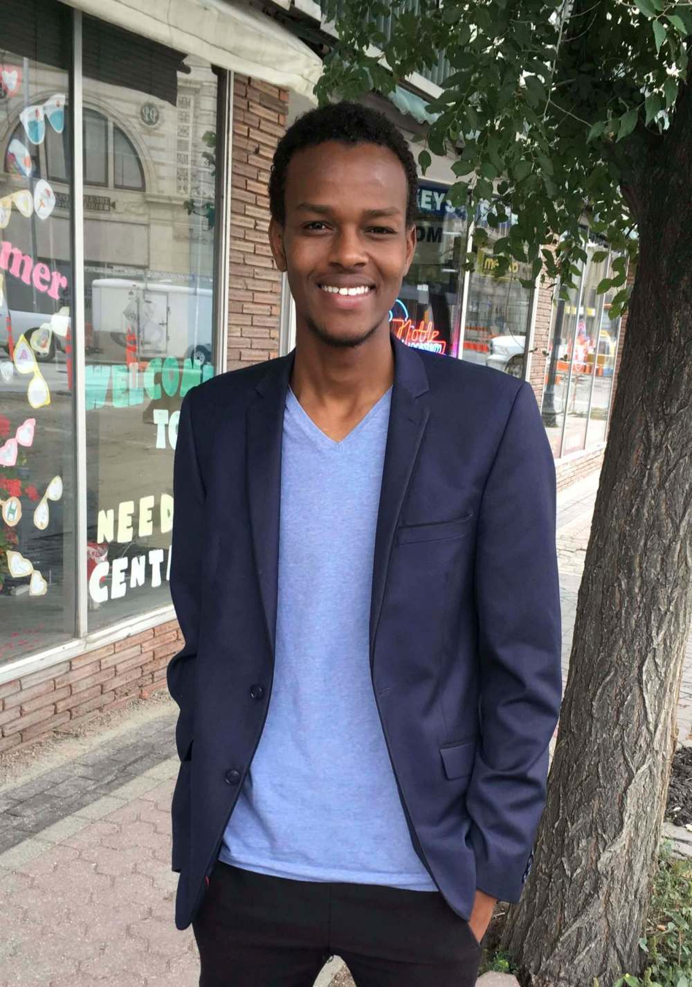 Aden Mohamed won a scholarship from Gordon Bell High School and will be studying math and science at the University of Winnipeg while working in retail to help support his family in Canada and back in an African refugee camp. (Carol Sanders / Winnipeg Free Press)
