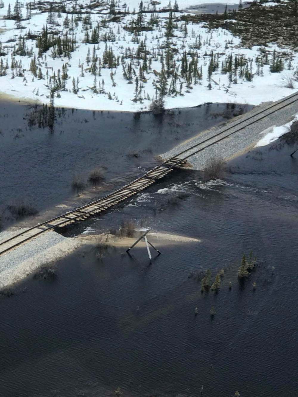 THE CANADIAN PRESS/HO-OmniTrax
File photo of the Hudson Bay Railway showing flooding that submerged a section of the track forcing the rail link to be closed.