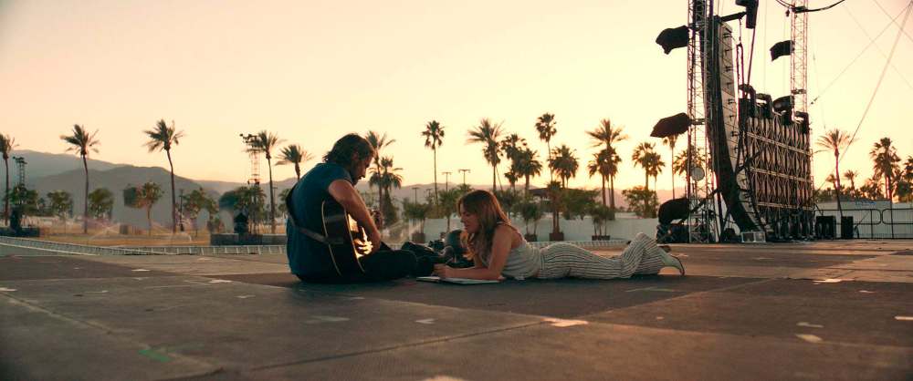 Bradley Cooper (left) stars as rock star Jackson Maine alongside Lady Gaga in A Star Is Born.