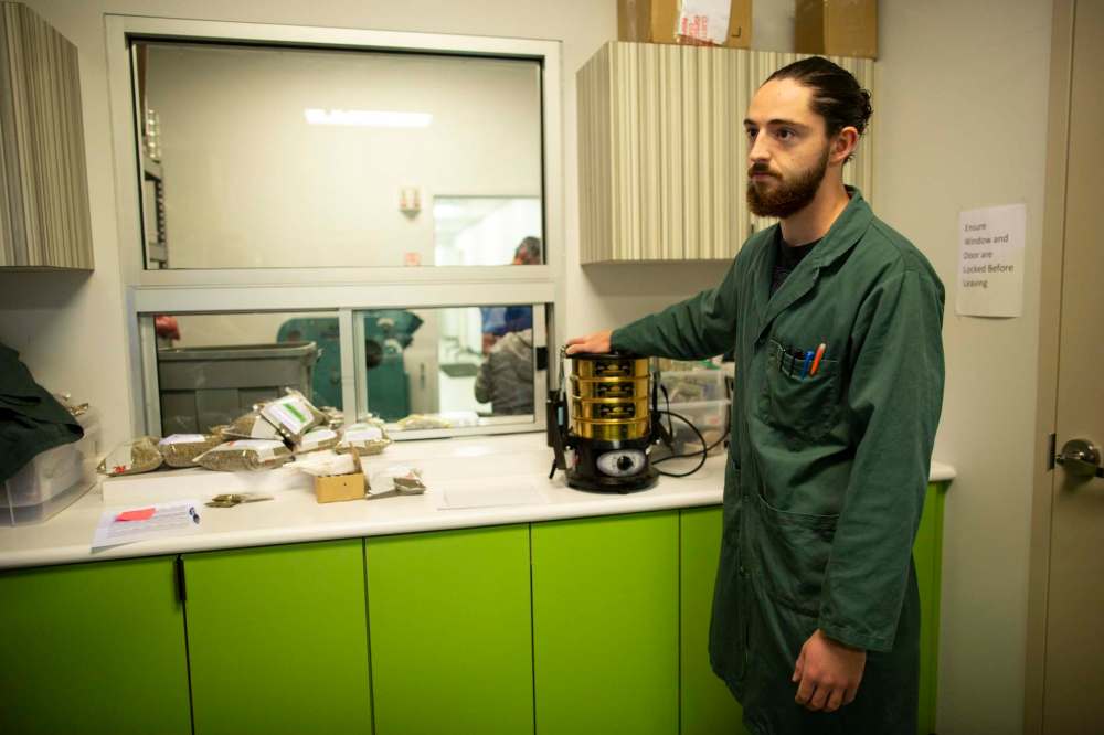 Lab technician Aaron Cassels at work in a health and safety lab at Hemp Oil Canada.