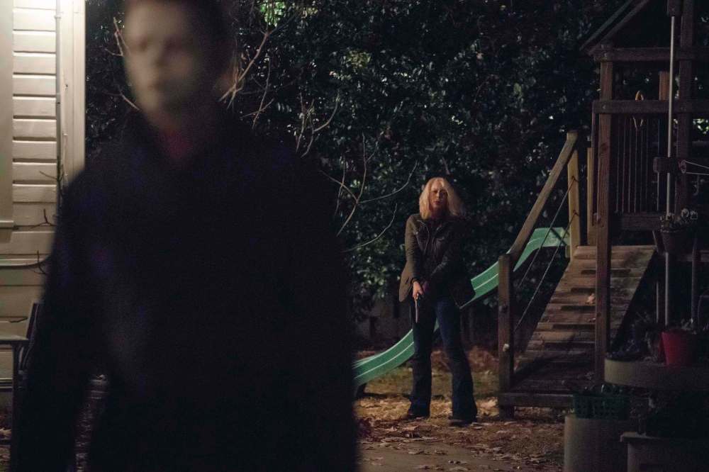 Laurie Strode (Jamie Lee Curtis) prepares to confront Michael Myers (Jim Courtney) in Halloween.