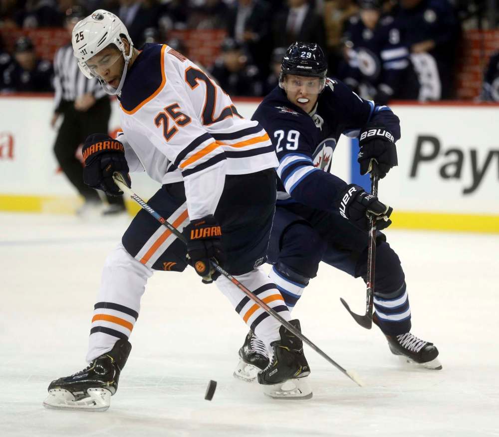 THE CANADIAN PRESS/Trevor Hagan
Winnipeg Jets' Patrik Laine moves around Edmonton Oilers' Darnell Nurse during the second period, Tuesday.