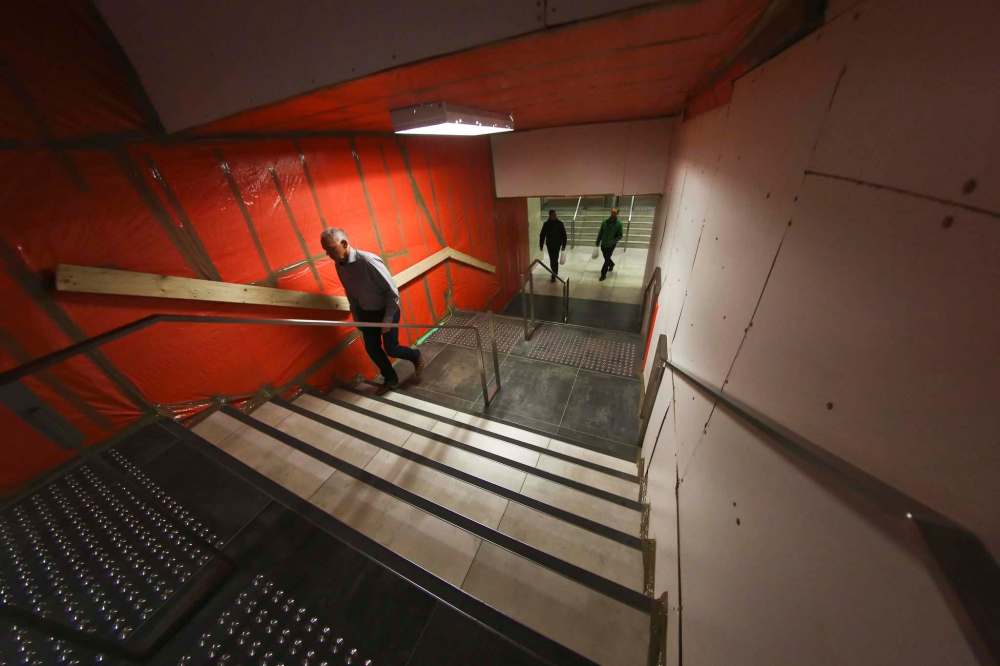 Tarps cover the walls in the stairwell after there was water damage. (Mike Deal / Free Press files)