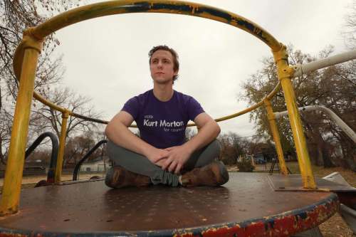 St. James council candidate Kurt Morton, sitting at a playground at Marjorie Park on Marjorie Street, says recreation infrastructure hasn't been a city priority for years. 
 RUTH BONNEVILLE / WINNIPEG FREE PRESS